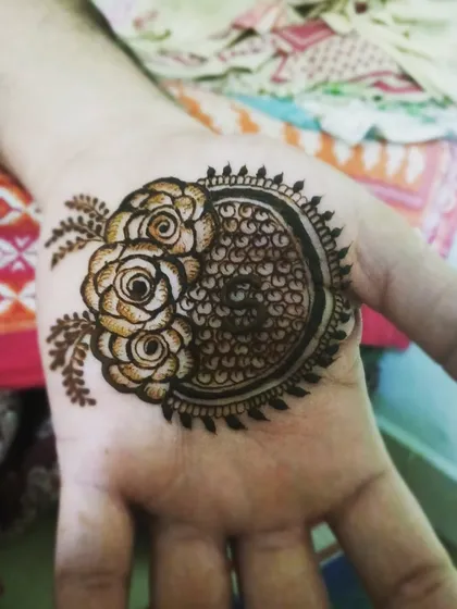 A beautiful patch-work design combining a circular pattern with realistic roses, perfect for clients who want a unique, concentrated motif.