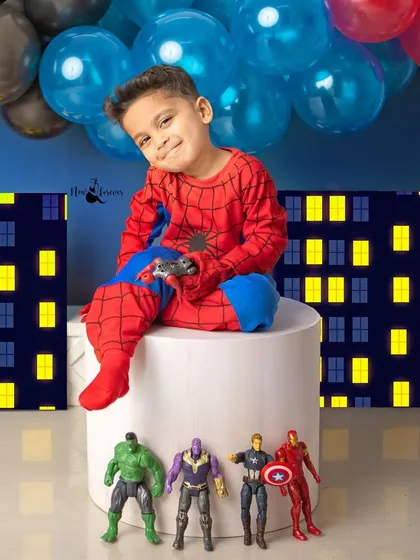 Taking a break from fighting crime to play some video games. This photo captures a fun, modern twist on the classic superhero theme.