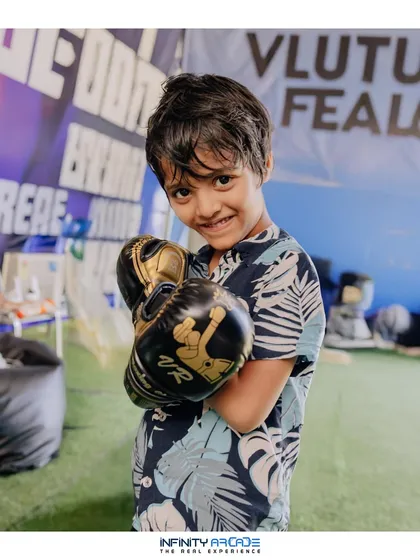 Even the youngest competitors get in on the action! A young boy poses with VR boxing gloves, showing that my events offer fun for a wide range of ages.