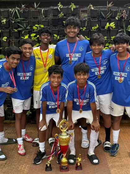 Champions! Our Under-15 team celebrating their victory with the trophy. A fantastic achievement by the players and Coach Allwyn.