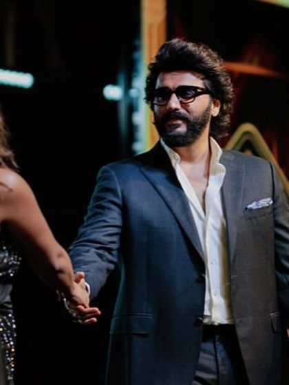 A handshake sealing a successful segment with Arjun Kapoor. Professionalism is key.