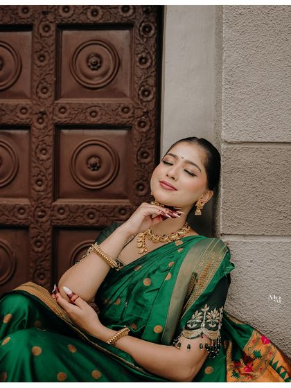 A serene portrait against a traditional wooden door. The bride's peaceful expression and elegant posture create a timeless and beautiful image.