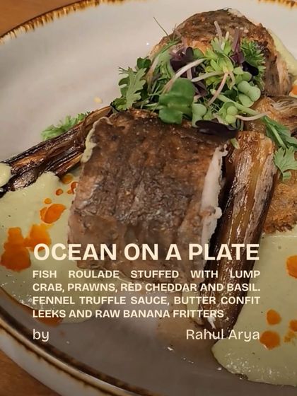 'Ocean on a Plate' by Chef Rahul Arya. A fish roulade stuffed with lump crab and prawns, served with a fennel truffle sauce and raw banana fritters. A truly innovative dish.
