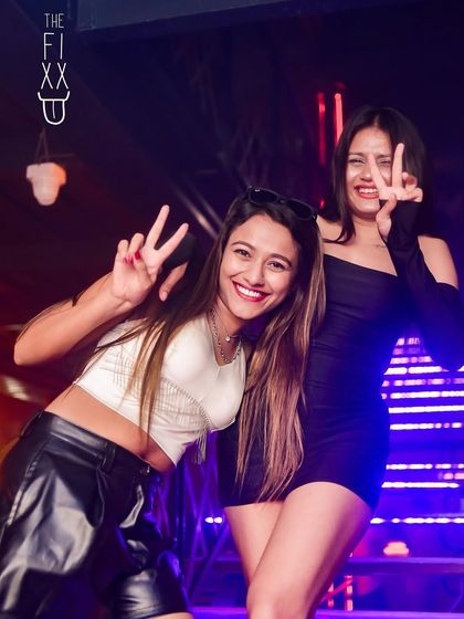 Peace and good vibes from the crowd during a packed Tuesday Ladies Night.