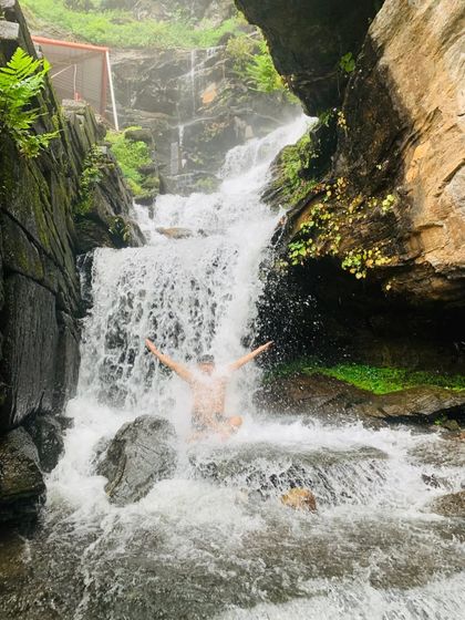 Taking a dip in the holy waters of Bheemeshwara Falls, right next to the ancient temple. It's a truly divine experience.