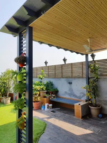 This view shows the full length of the pergola, providing ample covered space for seating and relaxation.