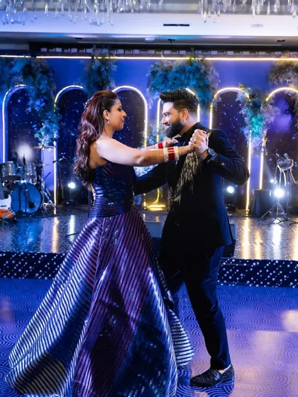 When their love is so palpable it fills the room, the dance becomes a celebration for everyone. This couple's first dance was a perfect blend of elegance and joy, set against a beautiful starry night theme.