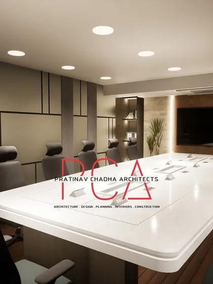 This visualization of the Narela conference room provides a clear view of the built-in shelving and the feature wall behind the screen, showcasing the amalgamation of wood and stone finishes.