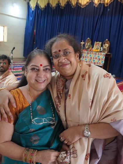 Two of our senior members share a warm moment during the Dasara celebrations, highlighting the strong community bonds at our conservatory.