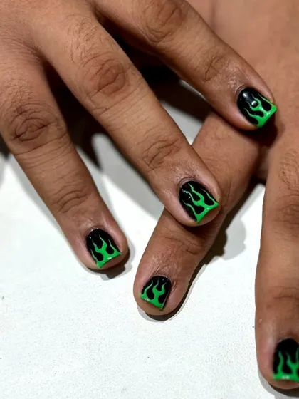 Nails have no gender. I created this edgy look with hand-painted neon green flames on a matte black base for a client who wanted to make a bold statement and break a few stereotypes.