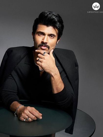 A full look from the Lifestyle Asia shoot with Vijay Deverakonda. Draping the Zegna blazer over the shoulders adds a touch of effortless cool to this otherwise formal, all-black ensemble.