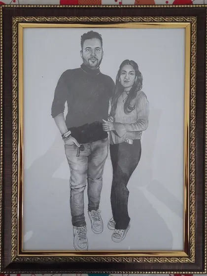 A custom A3-sized pencil sketch I did for a couple. Realistic pencil portraits are a popular choice for personal gifts, capturing a special memory in a timeless piece of art. This one is framed and ready to be displayed.