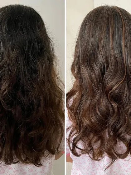 The power of a before and after. On the left, you see hair that was a bit frizzy and lacked dimension. On the right, after a professional color and treatment service, the result is smooth, defined waves with beautiful, subtle highlights that look completely refreshed.