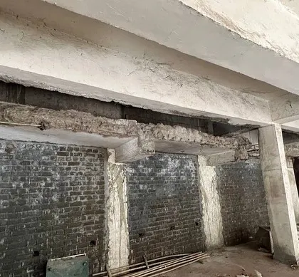 A look at the original exposed beams and brickwork. Our challenge was to integrate modern services like central air conditioning within the existing, restrictive structure.