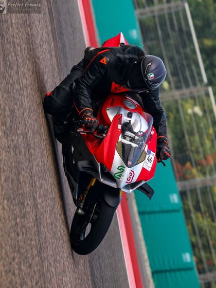 A Ducati Panigale perfectly positioned for the corner exit at Buddh International Circuit. We teach you how to throw fear away and focus on the perfect line.