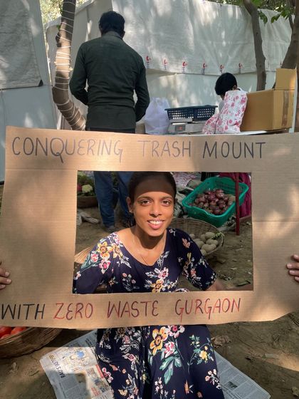 One of our core team members, Sargam, taking a moment to celebrate our collective effort at a 'Purana Baksa' event.