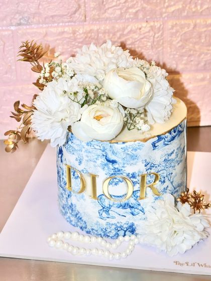 Another view of our Dior-inspired cake, a chic and sophisticated design that brings high fashion to the dessert table.