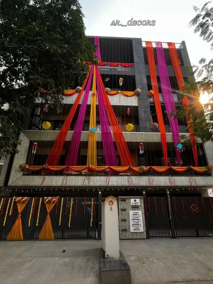 Another angle of the daytime home exterior decoration, showing how the drapes are arranged to cover multiple floors and create a grand visual impact.