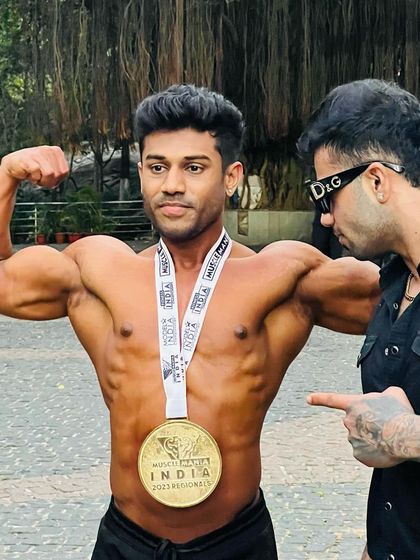 Celebrating a gold medal win at Muscle Mania India. I'm there with my client to guide him every step of the way.