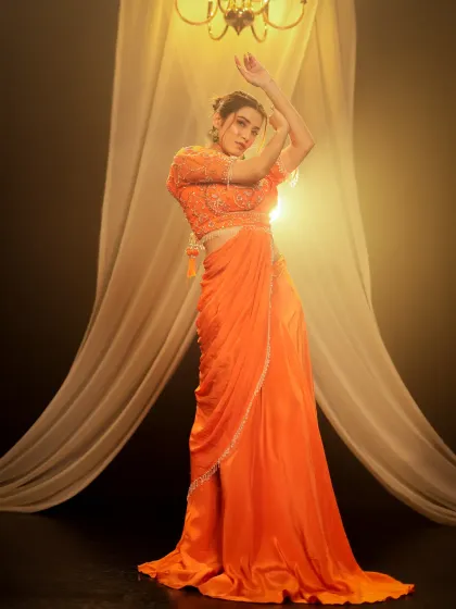 I use controlled studio lighting to make colors pop, as seen in this vibrant ethnic wear shoot. The setup with warm light and flowing fabric creates a dramatic and elegant mood, ideal for designer lookbooks and festive campaigns.