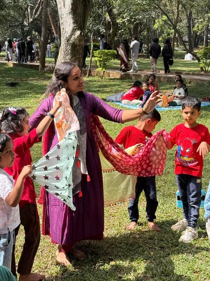 It's not just about listening, it's about feeling the story! Here, we're using colorful scarves to dance and express ourselves, bringing the narrative to life through movement. This kind of sensory play is a core part of our immersive workshops in Cubbon Park.