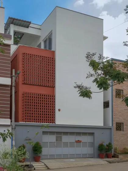 The Kadambini Residence features a bold, dynamic brick facade that stands in minimalist contrast to its surroundings. This design choice was central to the home's character, creating a visually striking exterior that filters light and ensures privacy.