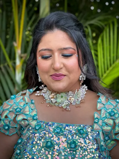 Another angle of the makeup, highlighting the flawless skin and the unique details.