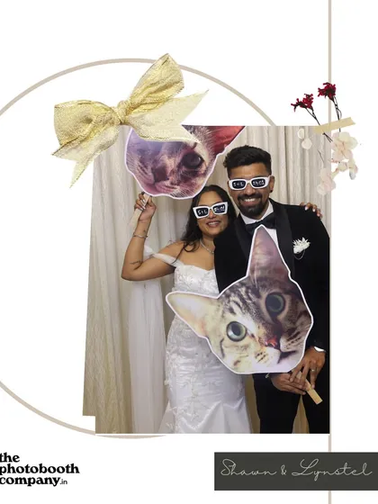Even the pets can join the party. We love creating custom props, like these cat faces for a couple's wedding reception, to add a personal and humorous touch that reflects your unique story.
