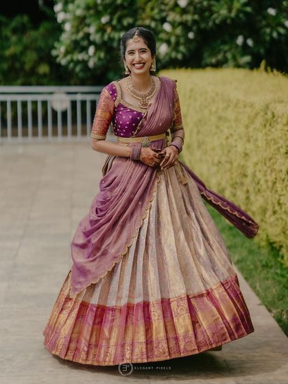 A duplicate image of the traditional purple and off-white half-saree.