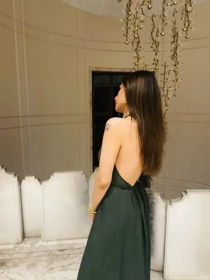 A view of the back of my green maxi dress. The backless design is a great feature for a vacation evening outfit.