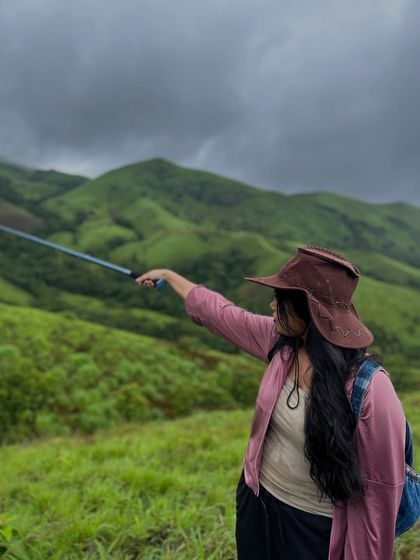 Pointing towards the next peak. A trekker charts the course on the beautiful Netravathi trail.