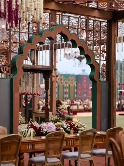 A beautifully framed view of the larger event space, seen through a traditional archway. This demonstrates my approach to designing spaces with interesting perspectives and photo opportunities.
