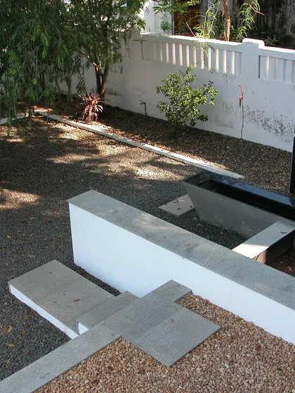 The quiet geometry of the outdoor space at VOC 1740 Stuber Hall. We used modern concrete forms, gravel, and a simple water channel to create a contemplative garden that respects the minimalist aesthetic of the original Dutch design.
