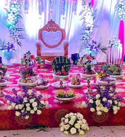Here is another angle of a stage setup in progress. You can see the variety of platters and floral arrangements I use to fill the space and create a rich, textured look for the ceremony.