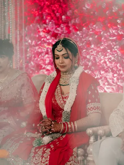 "Behind the veil, beyond the pose." This is a moment of pure, unfiltered emotion, capturing the bride's serene beauty and quiet contemplation on her wedding day.