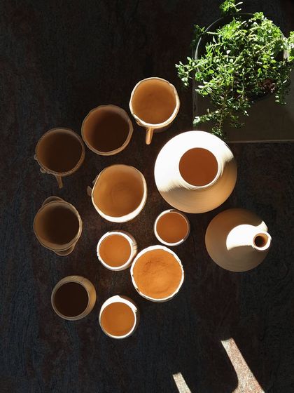 The way the sunlight hits these freshly thrown pots is just beautiful. This art truly makes you appreciate the simple beauty in life.