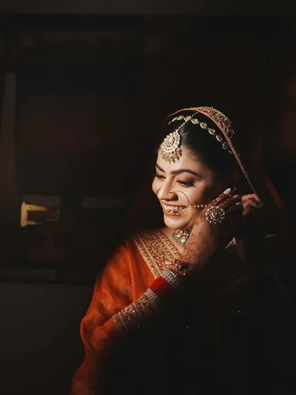 A moody and intimate bridal portrait, using shadows to create a dramatic effect.