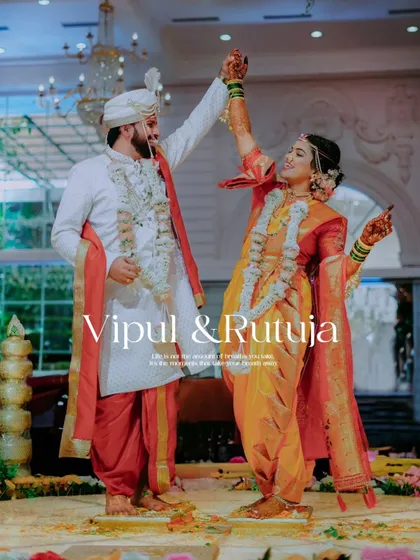 A moment of pure celebration on the reception stage. This shot captures the energy and happiness of a couple starting their new life together, surrounded by love.