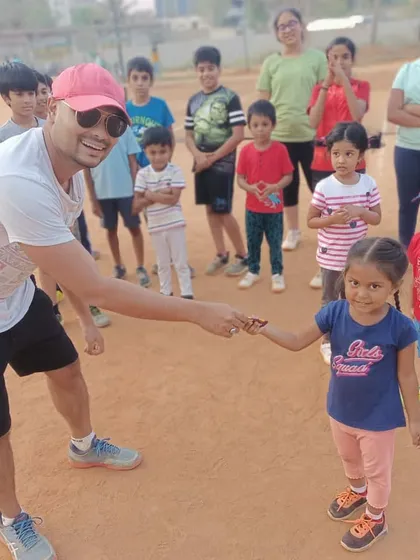 That smile is what it's all about! Celebrating our youngest 'Player of the Week' winners. I make sure to recognize effort and a great attitude at every age, which is a core part of our kids' tennis program.