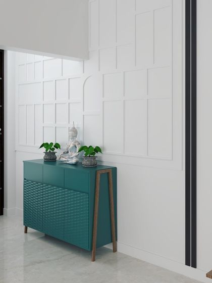 A 3D render of a foyer design. It features a stylish console table in teal, set against a wall with classic beading, creating an elegant and welcoming first impression.
