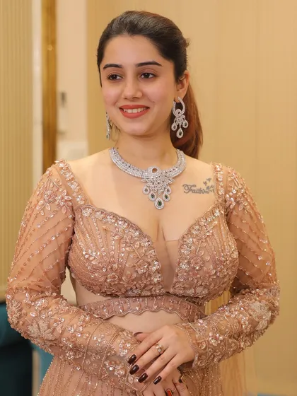 A client looking radiant in our luxury fish-cut lehenga. The plunging neckline and full-sleeve design create a balanced and sophisticated look.