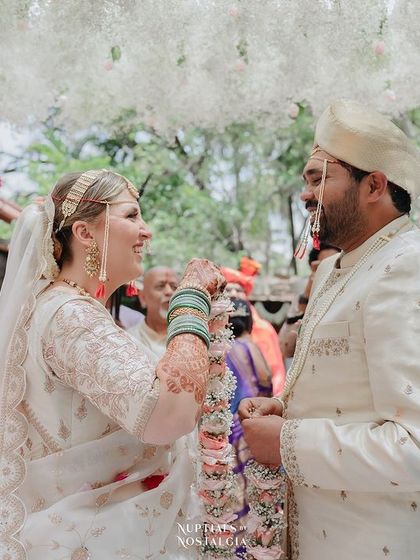 The exchange of garlands, a joyful and significant ritual symbolizing acceptance and union.
