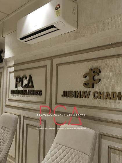 Wall branding for the Jubinav Chadha studio, set within classic wall mouldings for an elegant and established look.