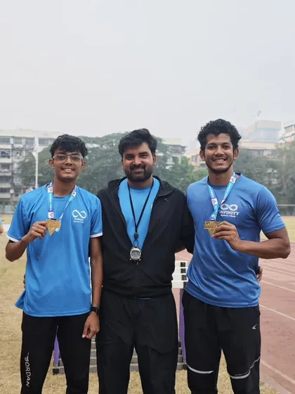 Two of my athletes celebrating their gold medals. Their success is my success.