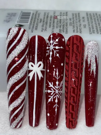 A slightly different angle of the red and white festive nails, highlighting the sparkling candy cane design.