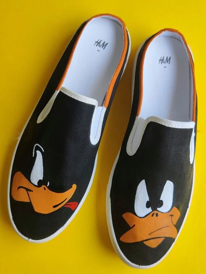 Another angle of the Daffy Duck custom slip-on canvas shoes.