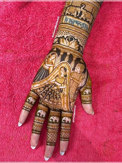 A beautiful bridal portrait featuring the varmala ceremony. The design also includes the word 'Karma' and small elephants on the fingers, adding personal and symbolic touches.