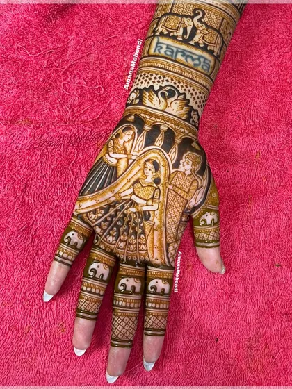 A beautiful bridal portrait featuring the varmala ceremony. The design also includes the word 'Karma' and small elephants on the fingers, adding personal and symbolic touches.