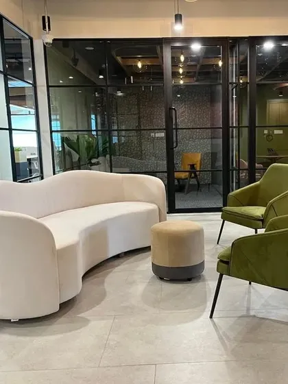 This curved sofa was custom-made for an office reception area. Creating non-standard shapes like this is a challenge I enjoy, as it allows me to deliver a truly bespoke piece that fits the architect's vision perfectly.