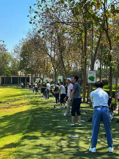 A long line of golfers on a sunny day, a testament to the vibrant community at our camp.